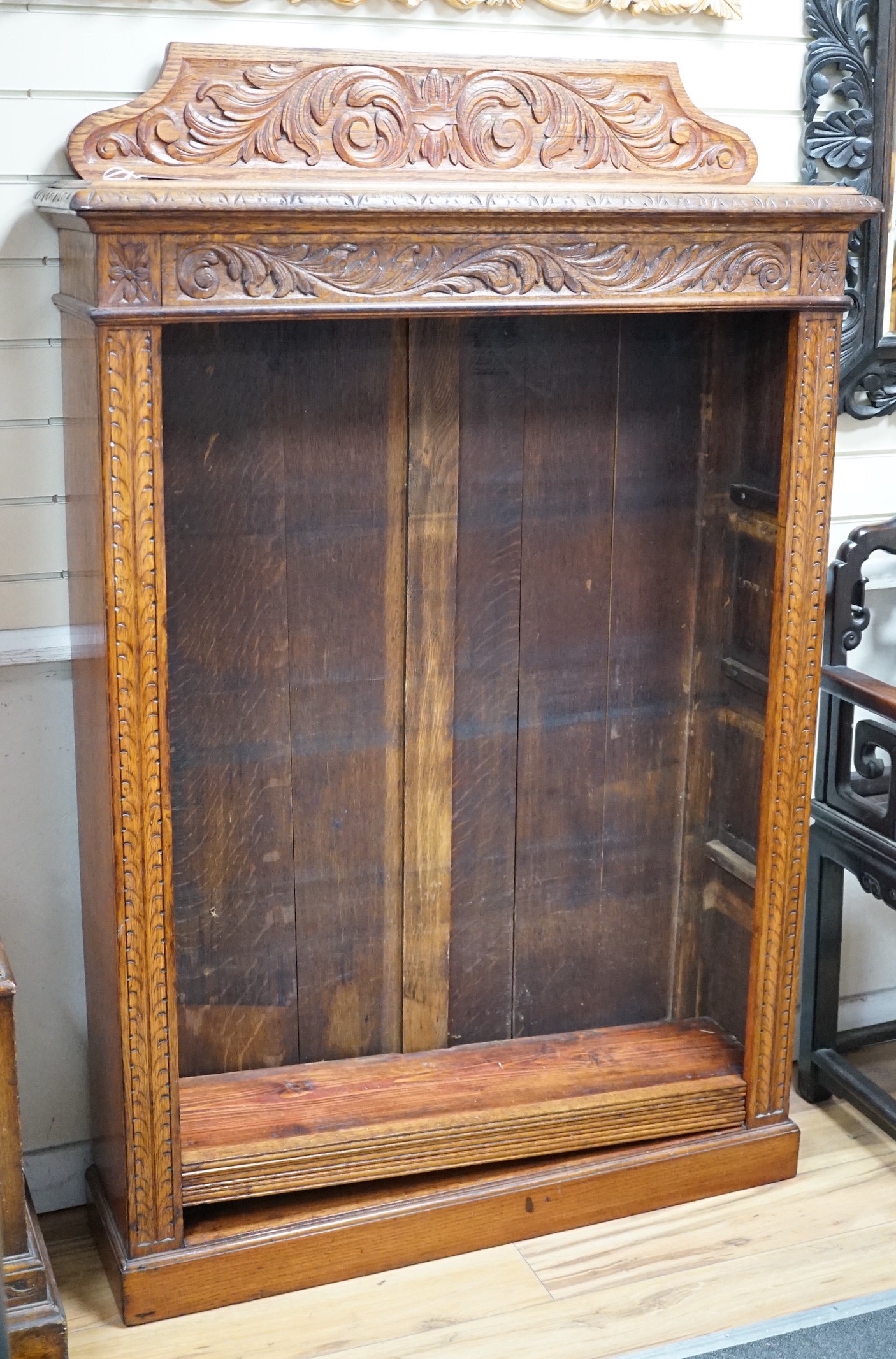 A late Victorian carved oak open bookcase, width 106cm *Please note the sale commences at 9am.